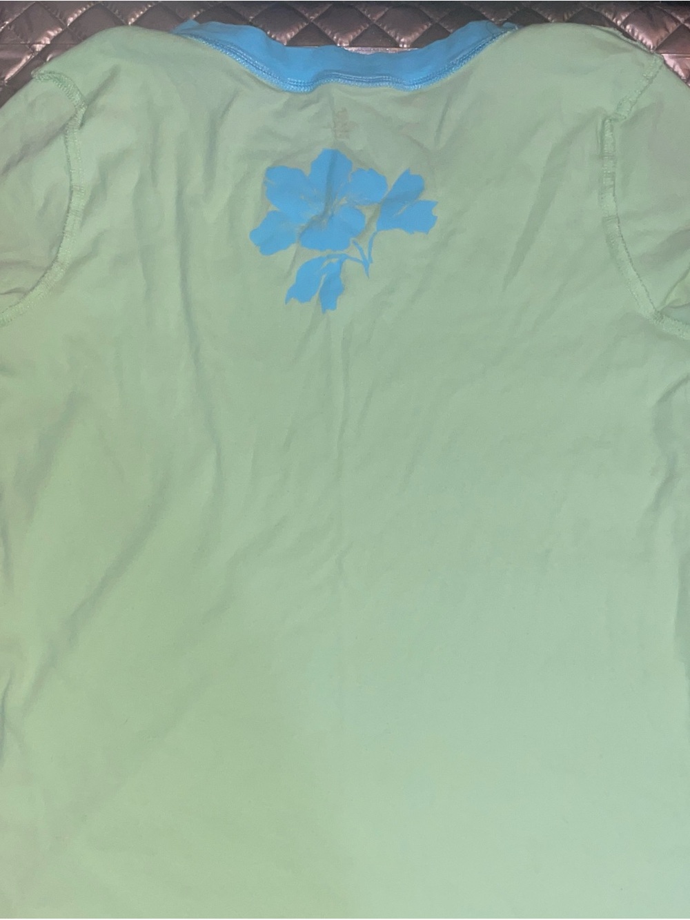 Green Short-Sleeve Top with Blue Floral Accent